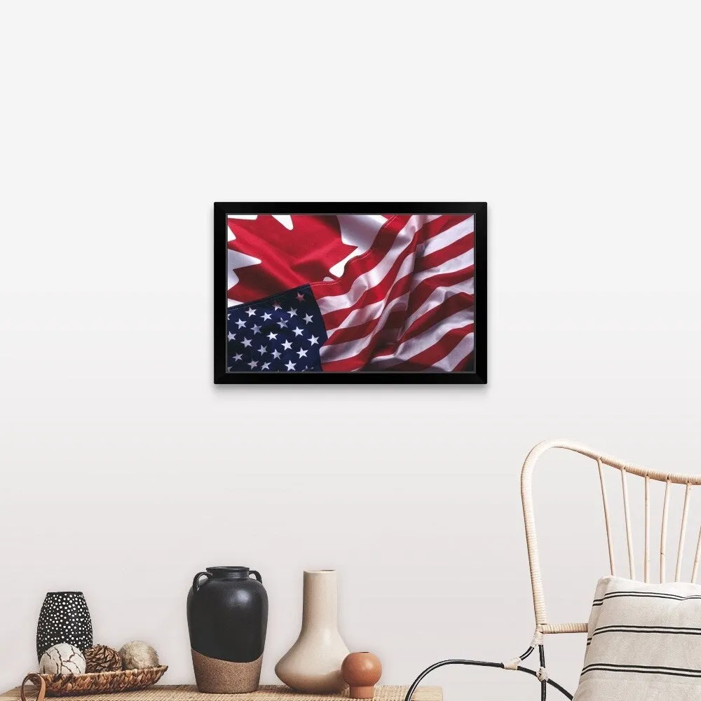 "An American and Canadian flag" Black Framed Print
